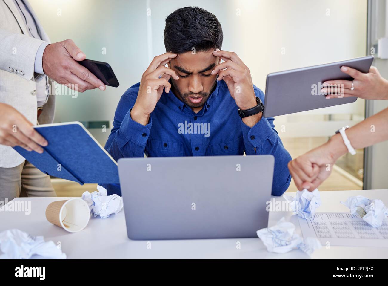 Am I imagining this. a young businessman looking overwhelmed in a ...