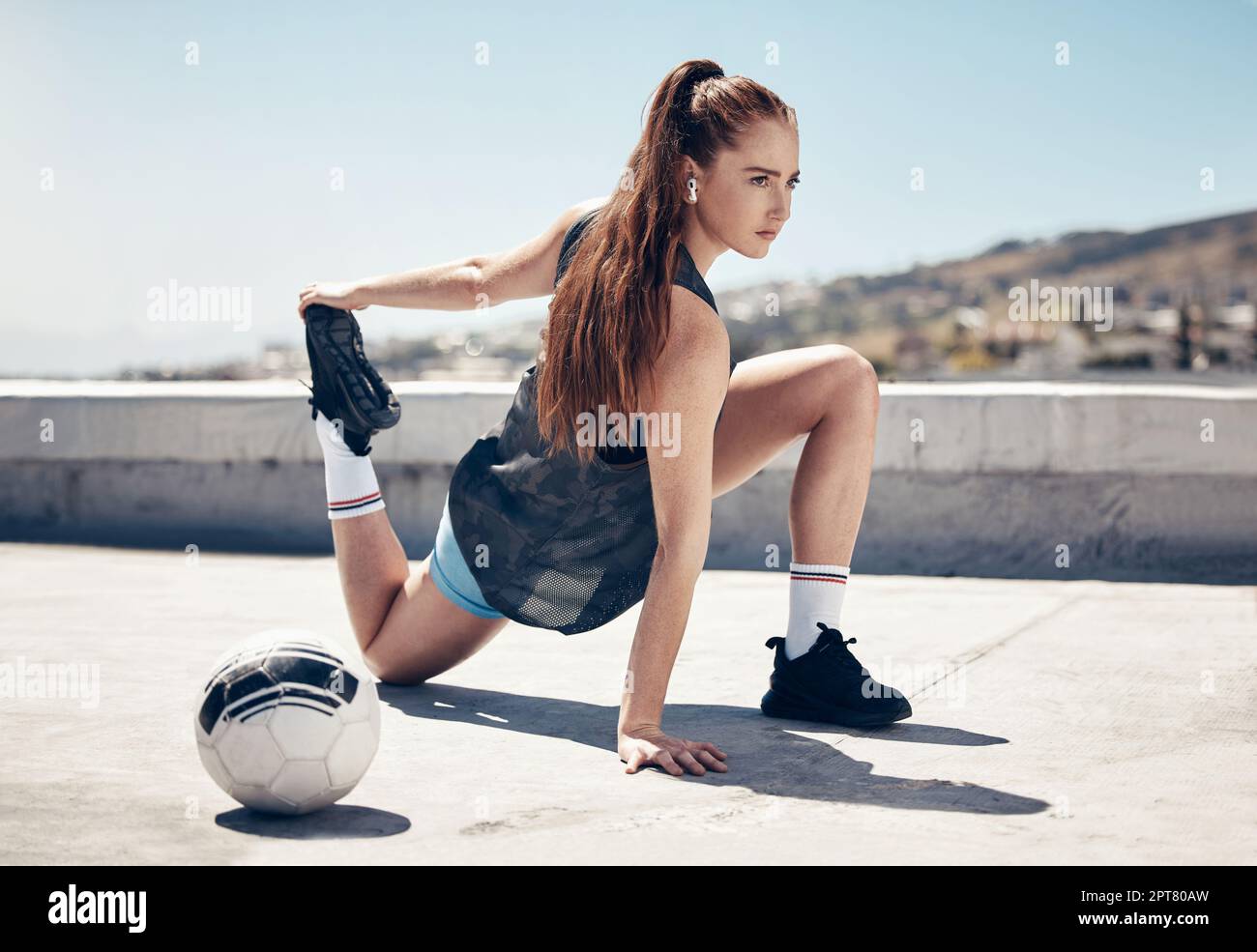 Soccer, woman stretching legs and rooftop sports game of athlete commitment  outdoor. Focus young girl football player, motivation and goals, body flex  Stock Photo - Alamy