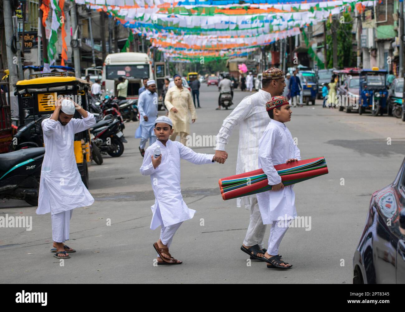 GUWAHATI, INDIA-APRIL 22 : Muslim people and children walking towards a ...