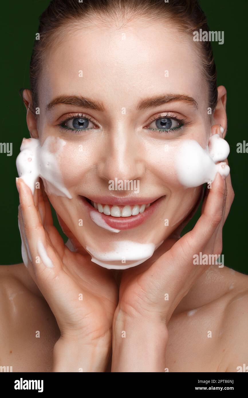 Beautiful young girl with facial wash on the skin. Beauty face. Picture
