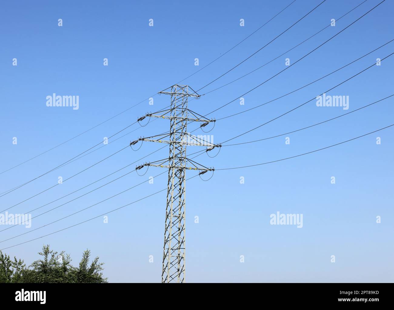 high voltage power pole and lines against the blue sky Stock Photo - Alamy