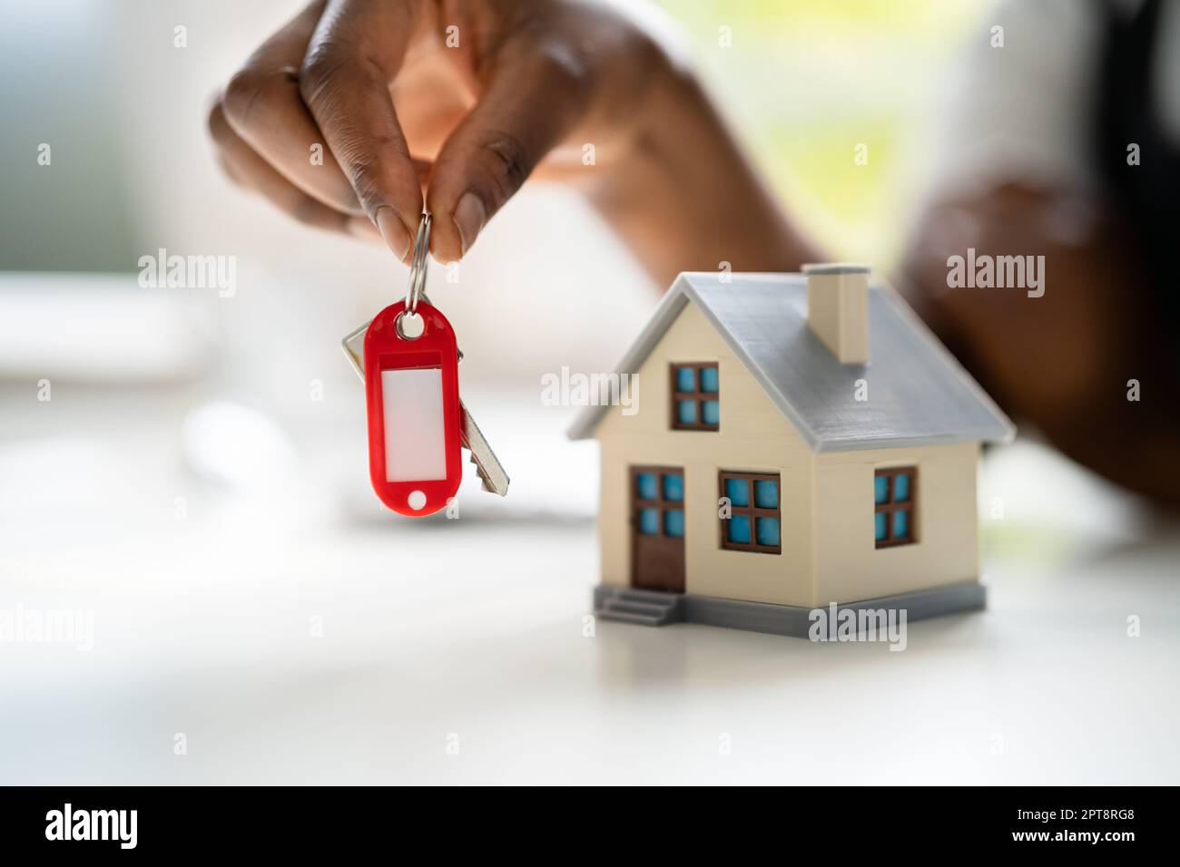 African American Real Estate Agent Giving House Key Stock Photo Alamy