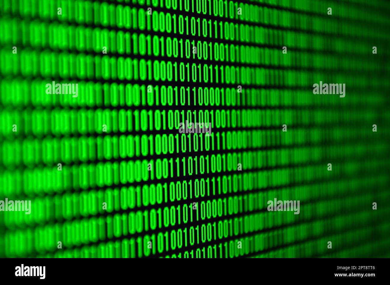 An image of a binary code made up of a set of green digits on a black background Stock Photo