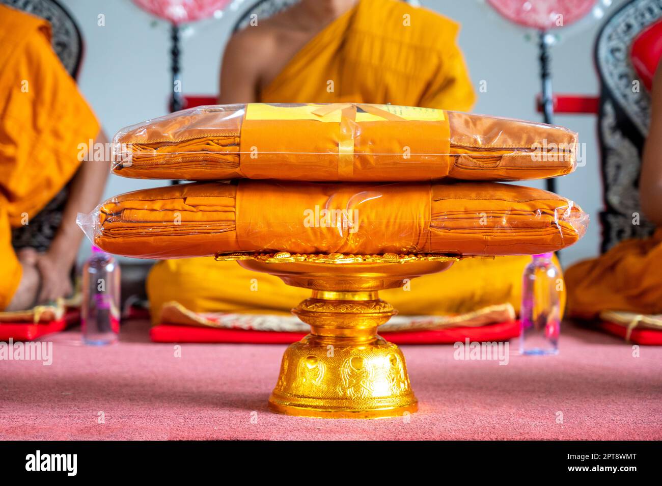 set of monk's robes placed on the pedestal Stock Photo