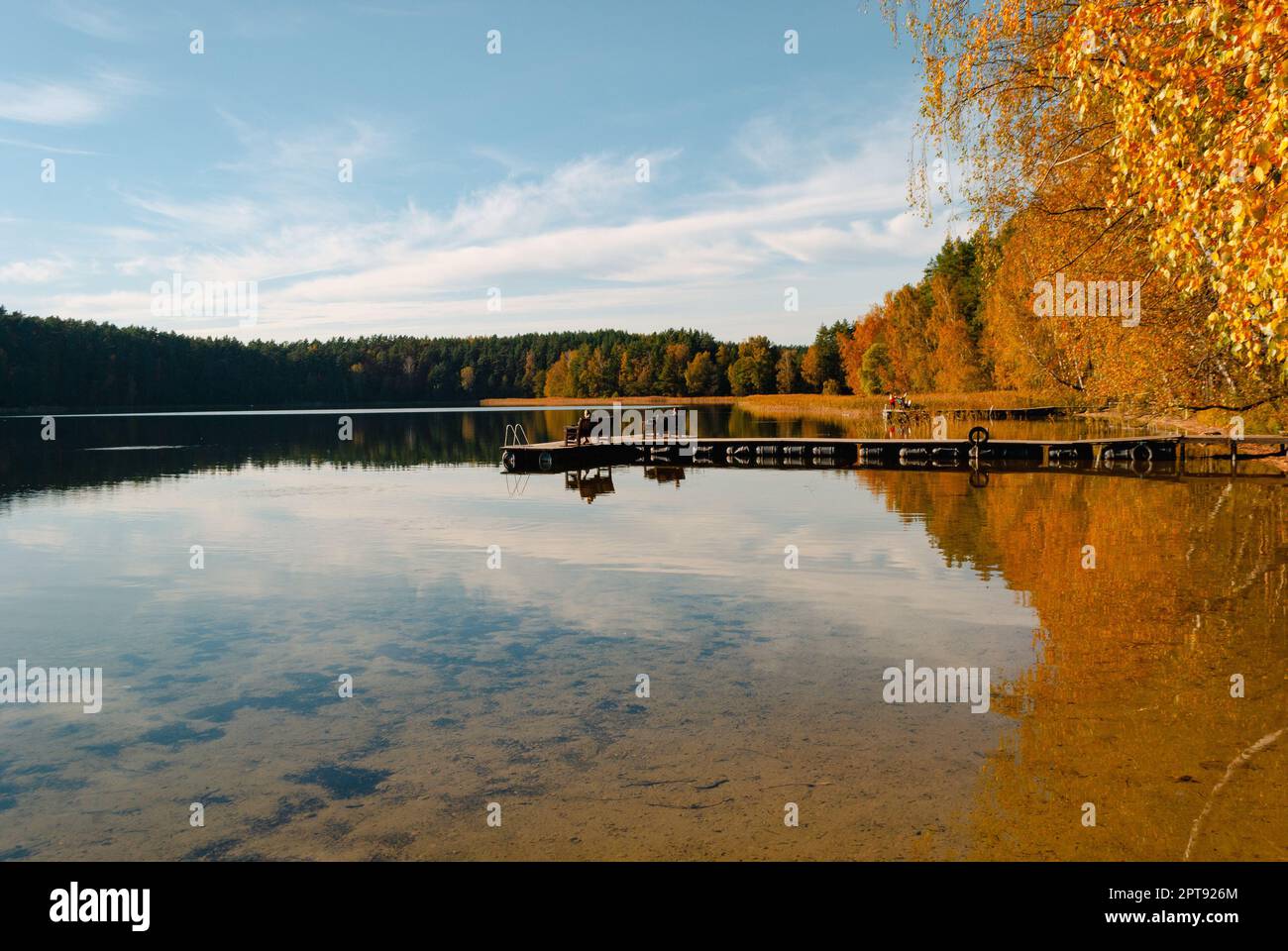 Lake Baltieji Lakajai with clear water in Labanoras Regional Park and a ...