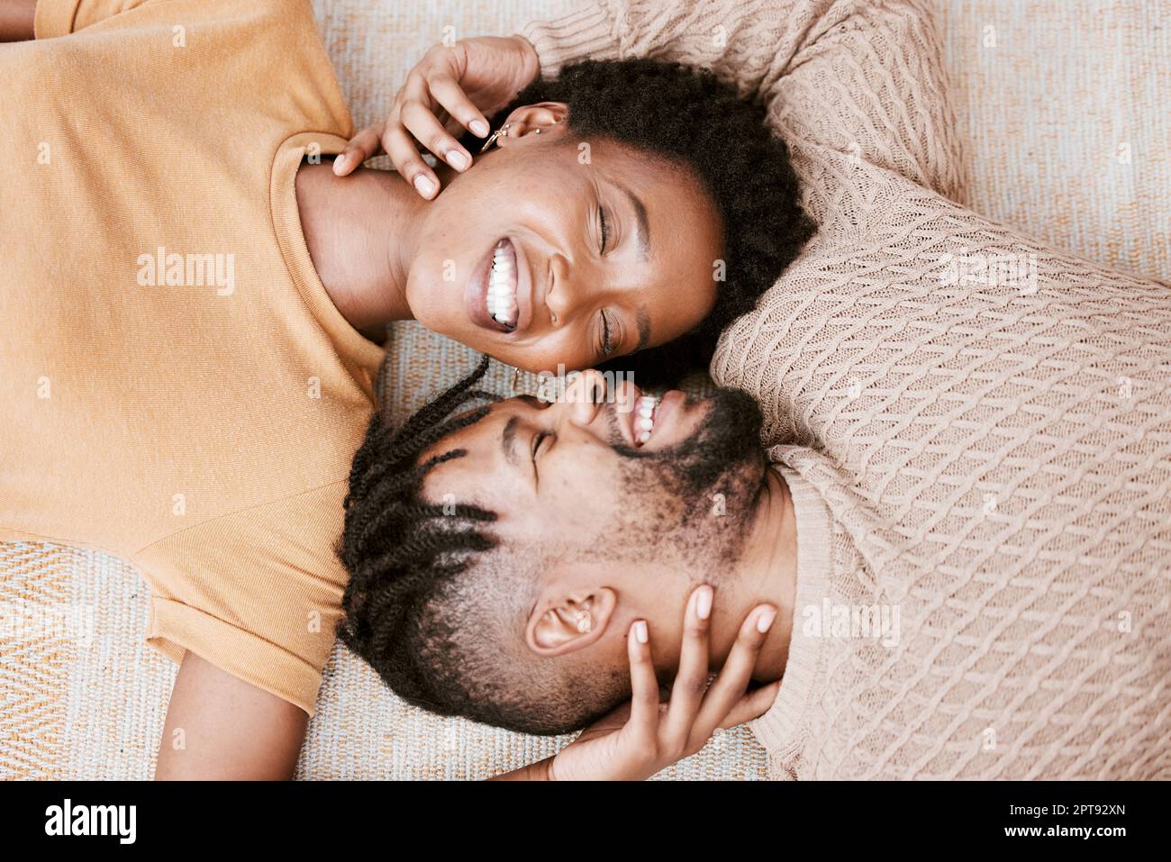 Youre more than enough for me. aerial shot of a young couple embracing at  home Stock Photo - Alamy