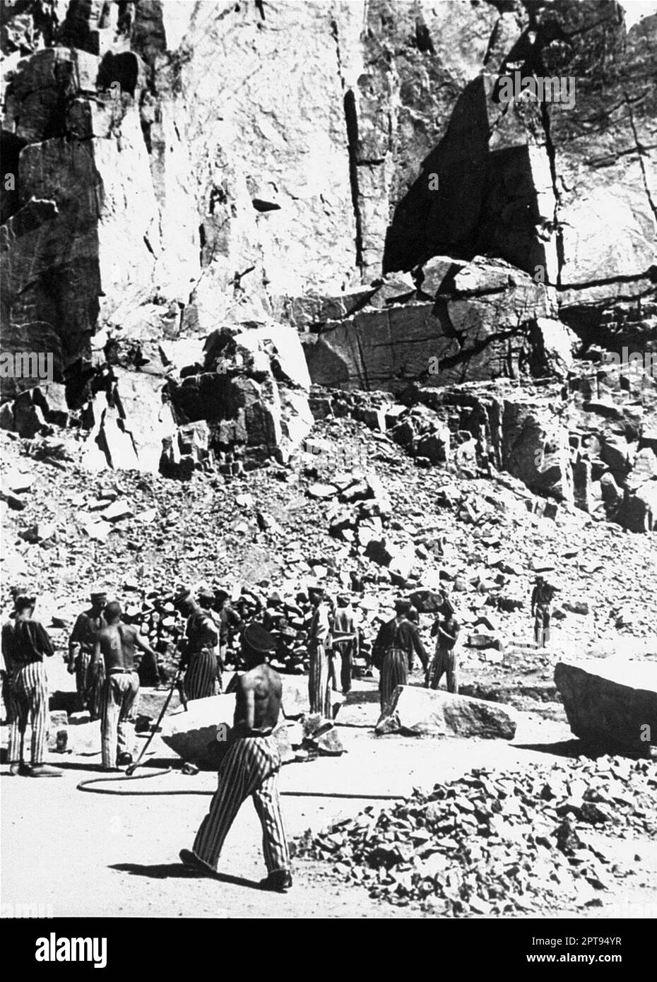 Prisoners at forced labor cutting stones in the Wiener Graben quarry at the Mauthausen concentration camp. Stock Photo