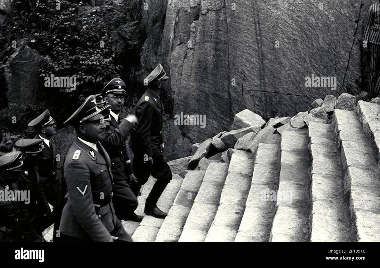 Heinrich Himmler on a visit to Mauthausen concentration camp. He is seen here climbng the notorious Stairs of Death (Todesteige). Prisoners were made to carry huge blocks of granite up there steps after a full day's labour. Death and injuries were daily events. Bundesarchiv, Bild 192-301 / CC-BY-SA 3.0 Stock Photo