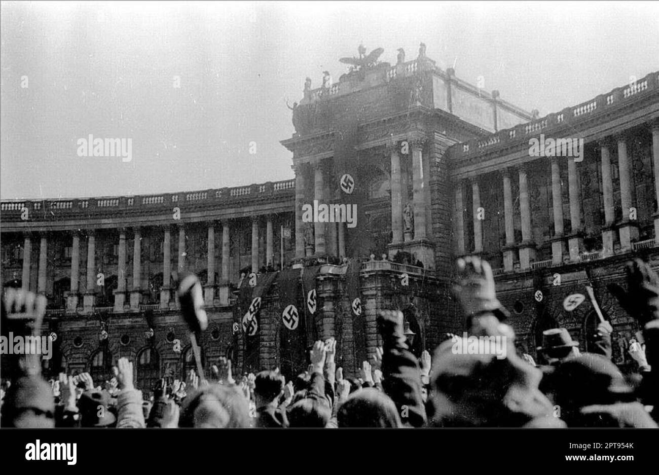 Jubilant crowds of Vienna's Heldenplatz cheering as Hiter announced the annexation of Austria and its incorporation into the German Reich. Stock Photo