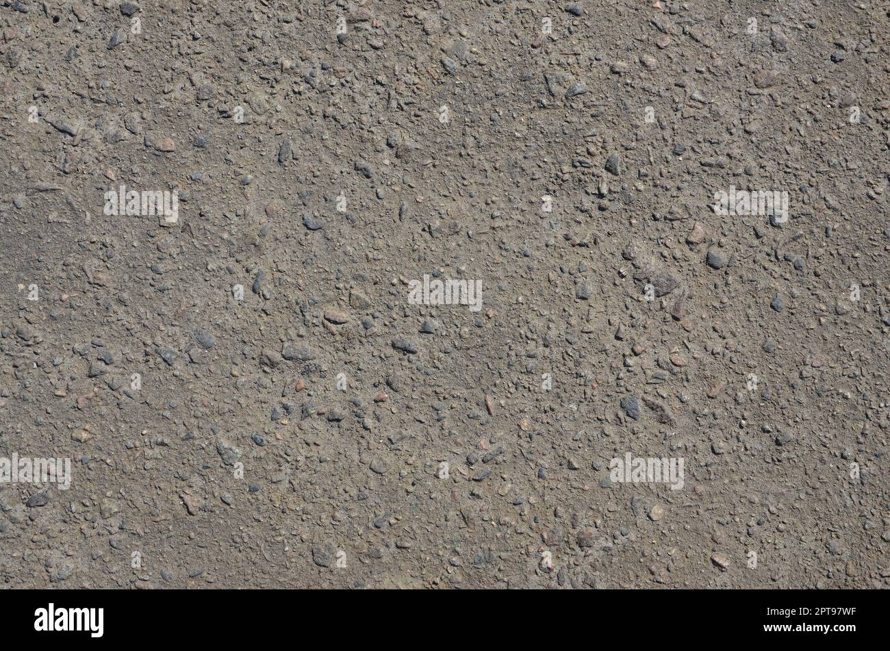 Texture of dirty and gloomy gray asphalt under sunlight during the ...