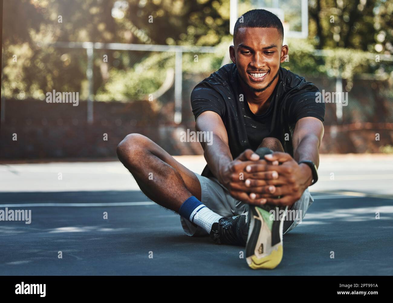 Black man, fitness and stretching leg in city, street or urban outdoors.  Sports, health and happy male from Nigeria on ground, warm up or getting  read Stock Photo - Alamy