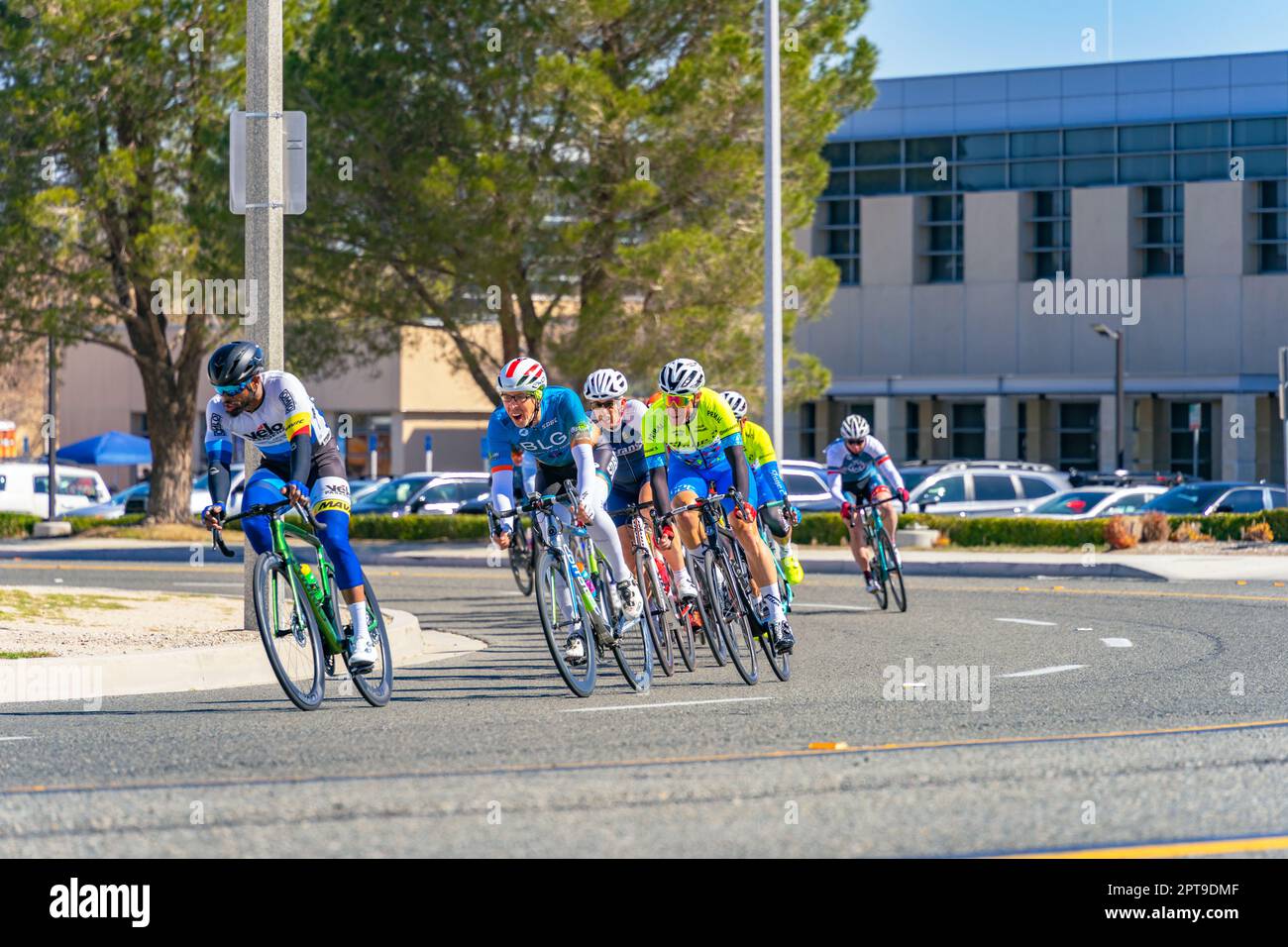 Victorville, CA, USA – March 26, 2023: Men’s cycling road race turning a corner in an event held by Majestic Cycling in Victorville, California. Stock Photo