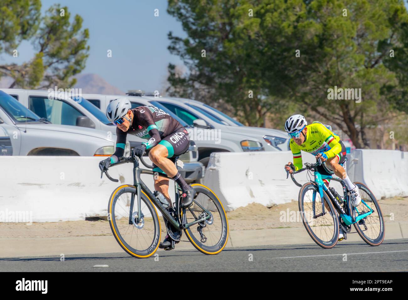 Victorville, CA, USA – March 26, 2023: Two men cyclists racing for the lead in a cycling road race in an event held by Majestic Cycling in Victorville Stock Photo