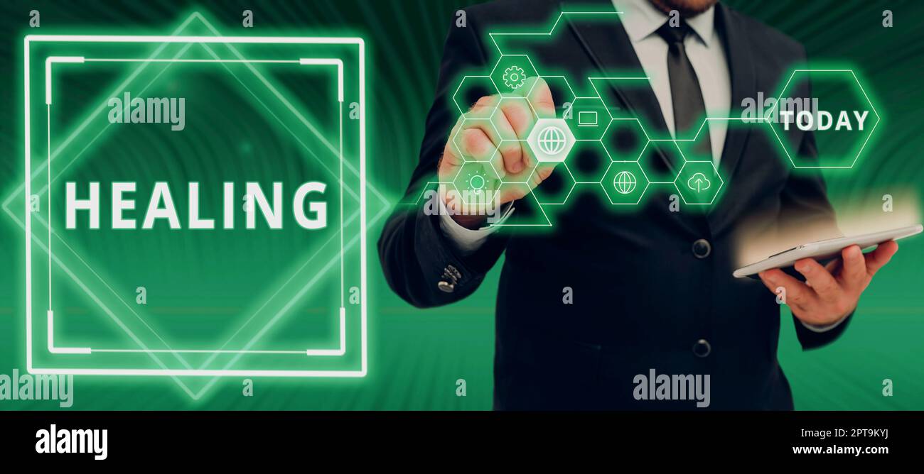 Hand writing sign Healing, Concept meaning process of the restoration ...