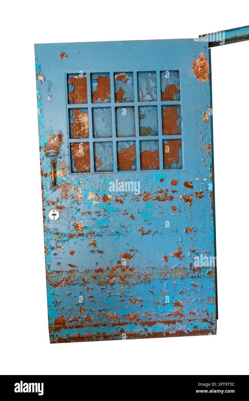 Rusted and paint chipped door in abandoned building isolated Stock