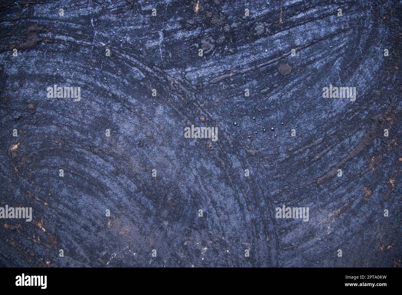 Old metal surface covered black ash abstract background texture Stock Photo