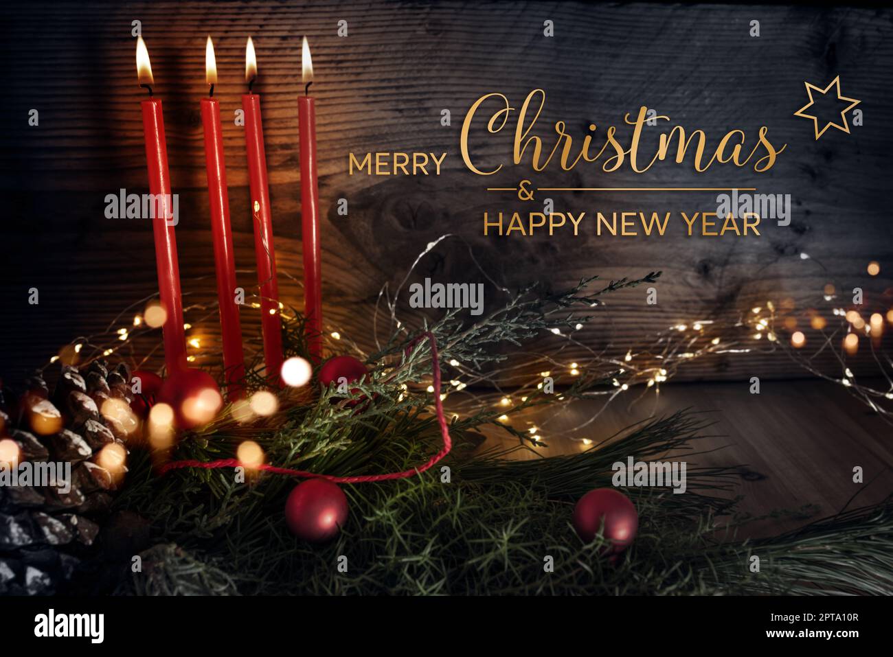 Christmas greeting card with english text - merry christmas and a happy new year - four red burning candles with natural decoration on rustic wood and Stock Photo