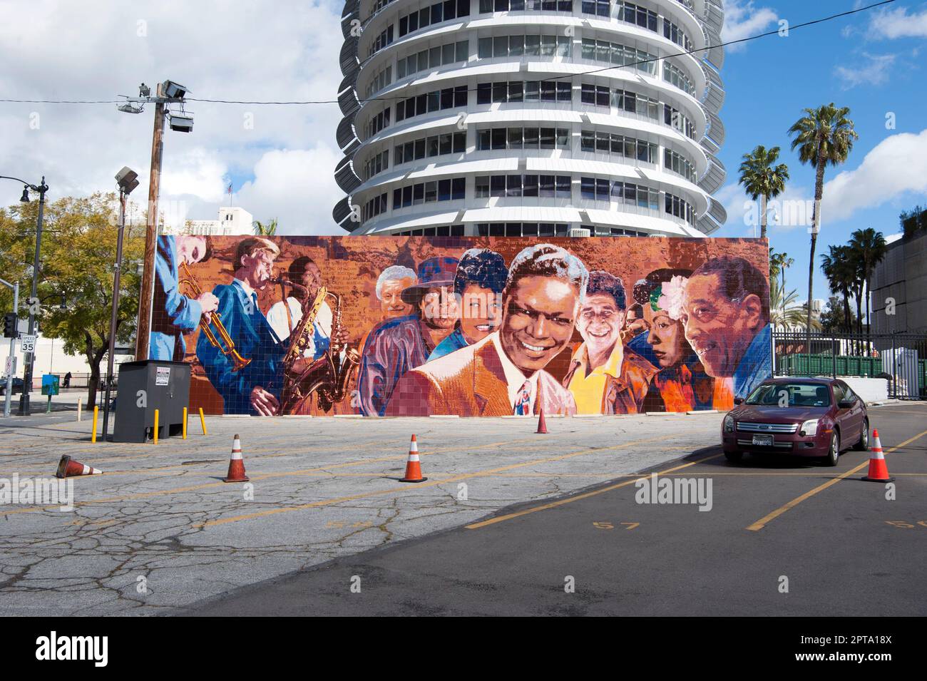 The Capitol Records building with a mural of Jazz greats including Nat