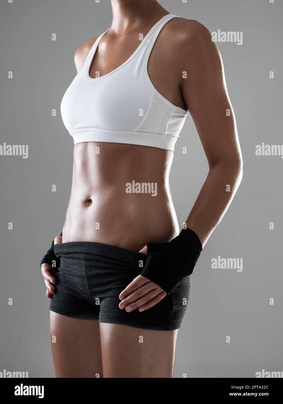 Fitness Exercise Sport Young Woman in Fashion Sportswear. Cropped Closeup  of the Sexy Boobs Girl, Muscular Body, Tan Skin and Strong Six Pack Abs.  Fem Stock Photo - Alamy