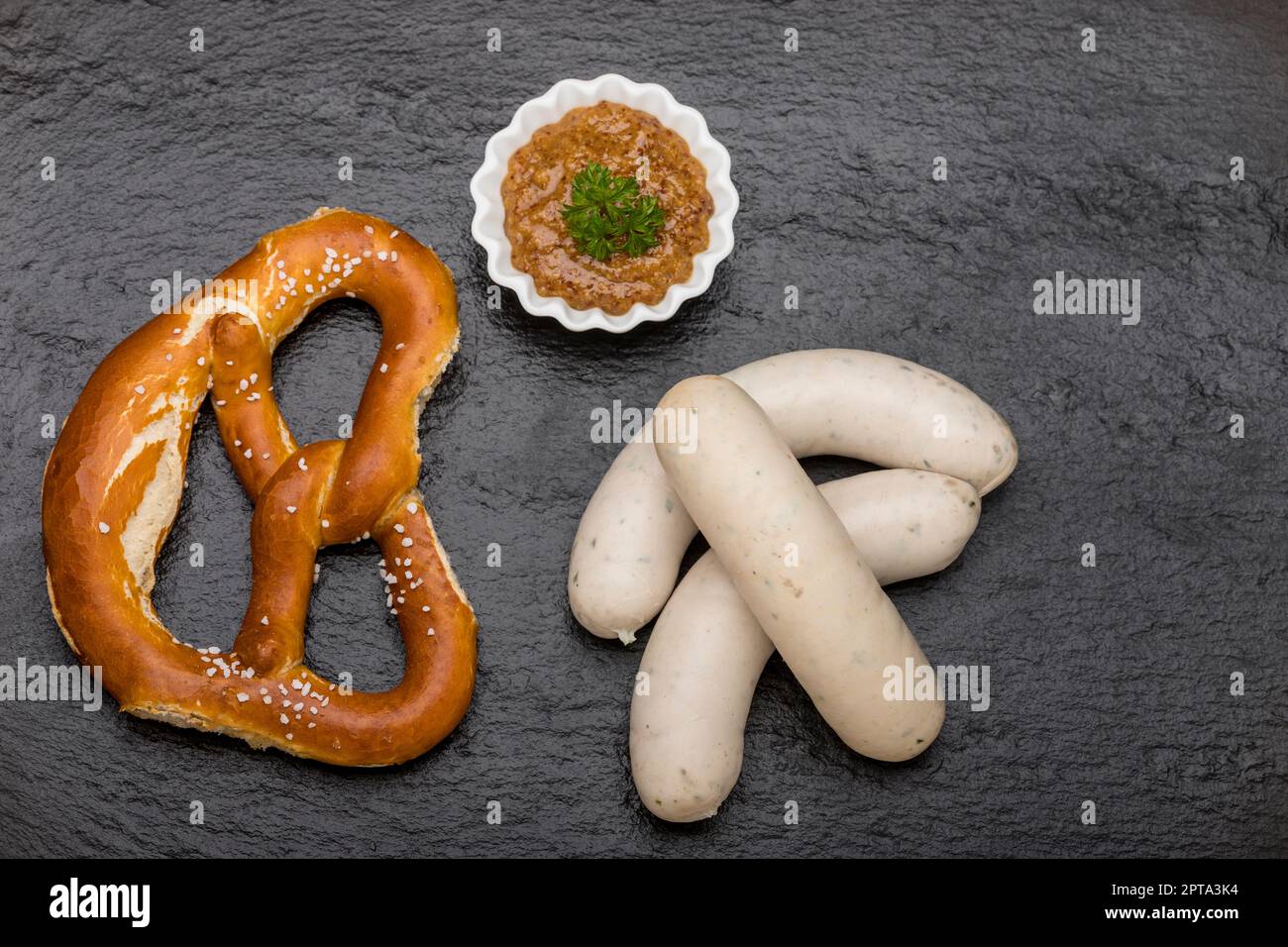 bavarian white sausages on black slate Stock Photo