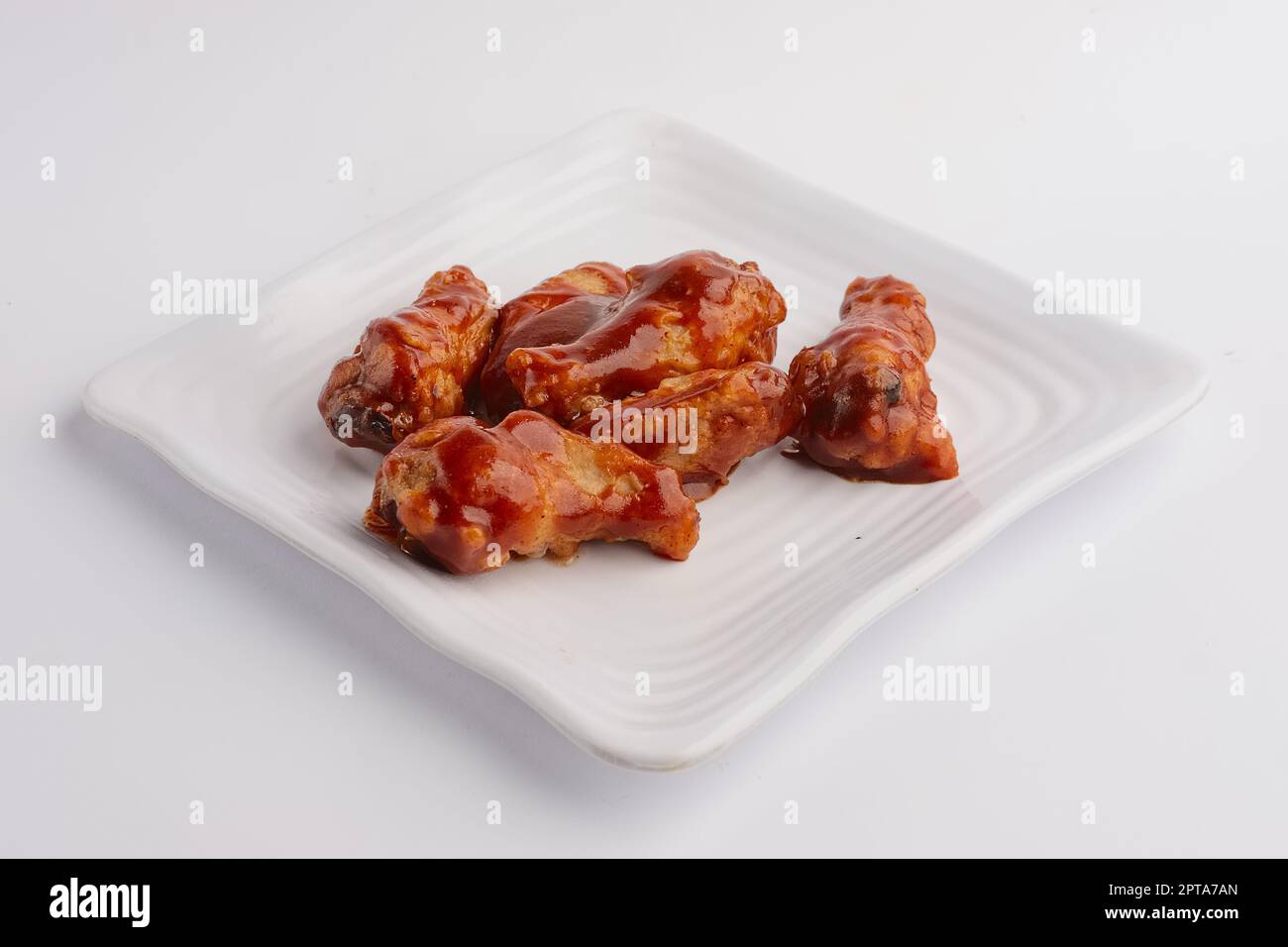 Hot spicy fried chicken wings Stock Photo - Alamy