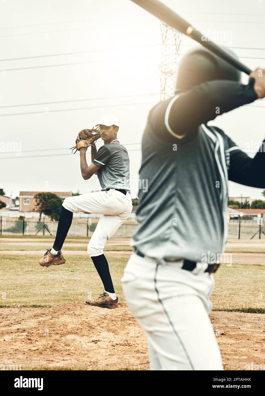 Baseball player, bat and pitcher on field for sports, fitness and