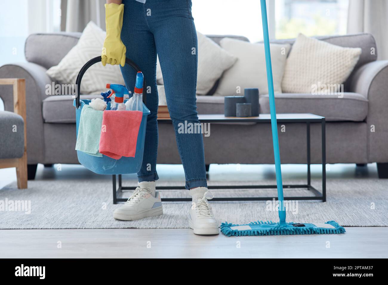 I have all my best cleaning products ready. an unrecognizable woman