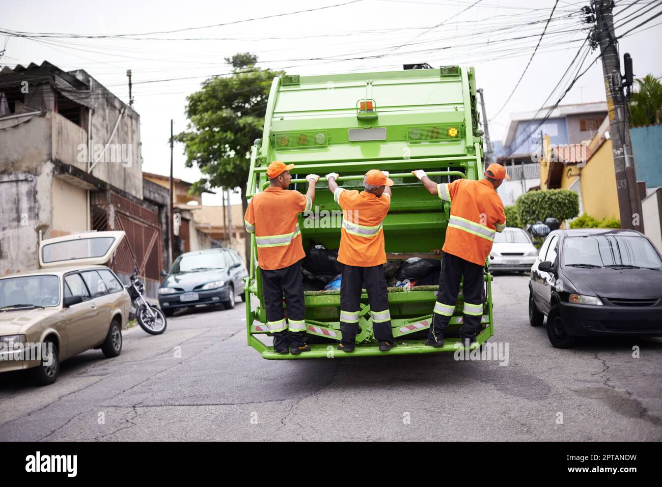 Garbage collection day. a garbage collection team at work Stock Photo