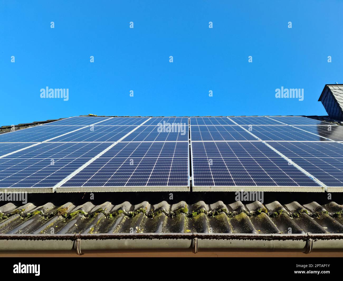 Solar panels producing clean energy on a roof of a residential house ...
