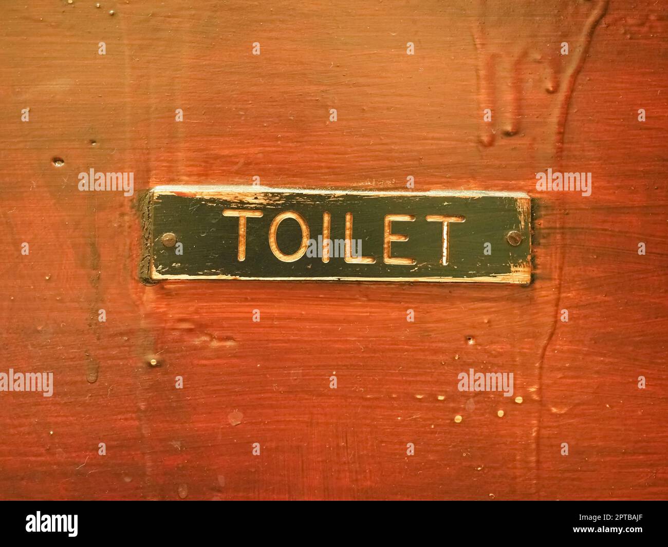 old toilet sign on a wooden door Stock Photo Alamy