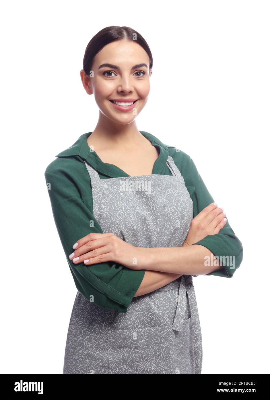 Young woman in grey apron on white background Stock Photo - Alamy