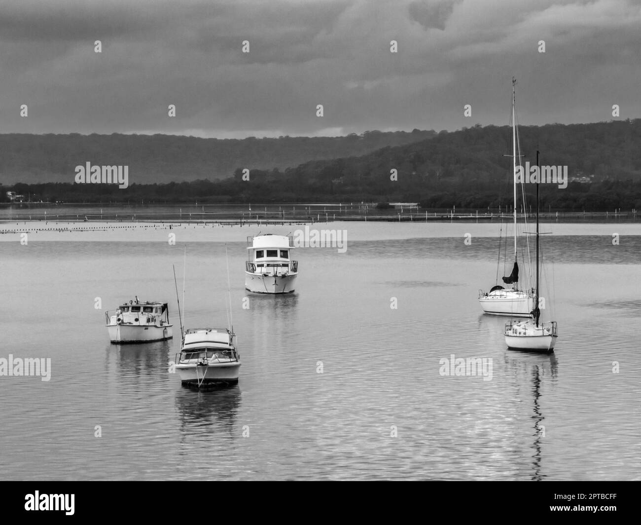Sunrise bay waterscape with clouds and boats on the Brisbane Water at