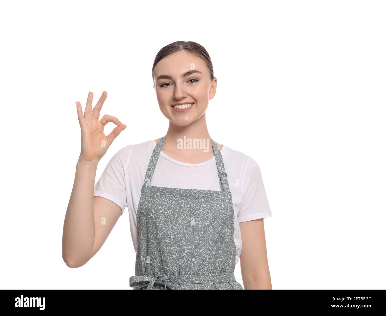 Beautiful young woman in clean apron on white background Stock Photo ...
