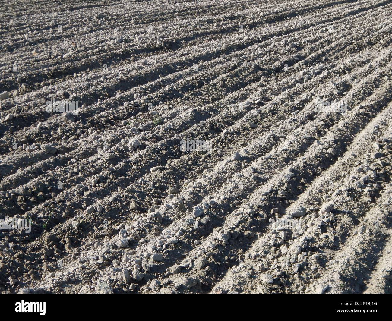 Tractor plowed field and arable land Stock Photo - Alamy