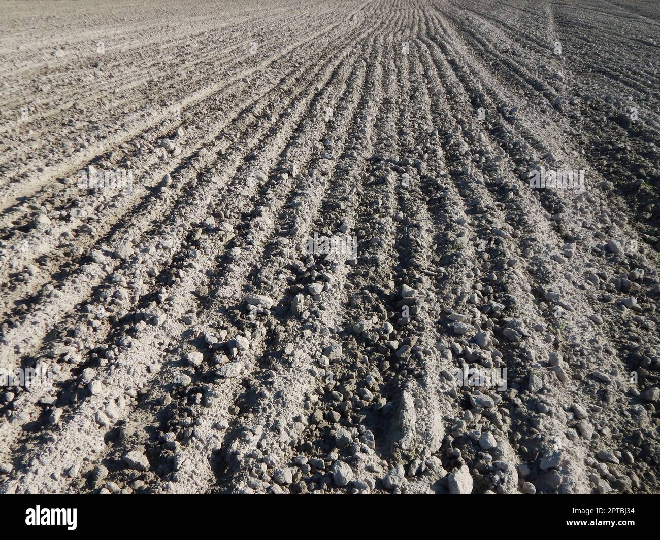 Tractor plowed field and arable land Stock Photo - Alamy