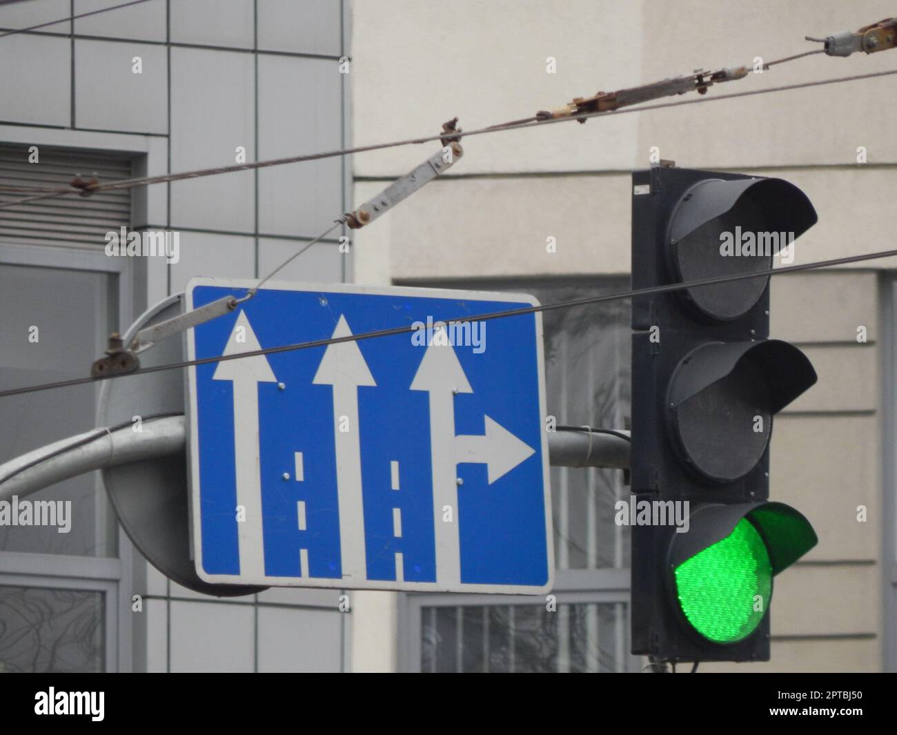 Road signs indicating the direction of movement of cars and pedestrians ...