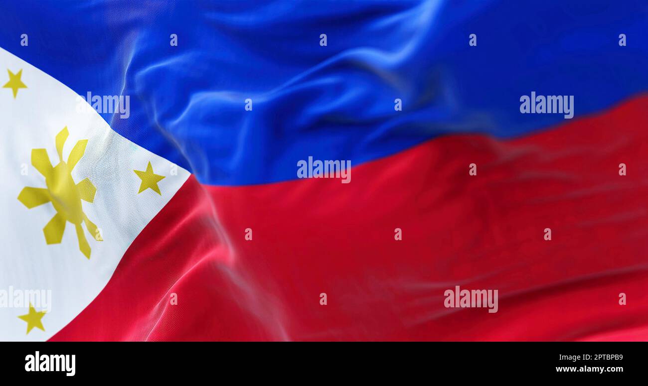 Close-up view of the Philippines national flag waving in the wind. The Republic of the Philippines is an archipelagic country in Southeast Asia. Fabri Stock Photo