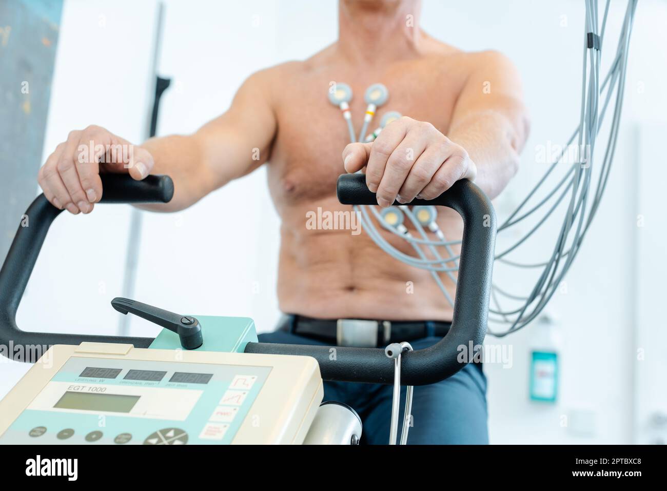 Patient during exercise ECG on stationary bike Stock Photo