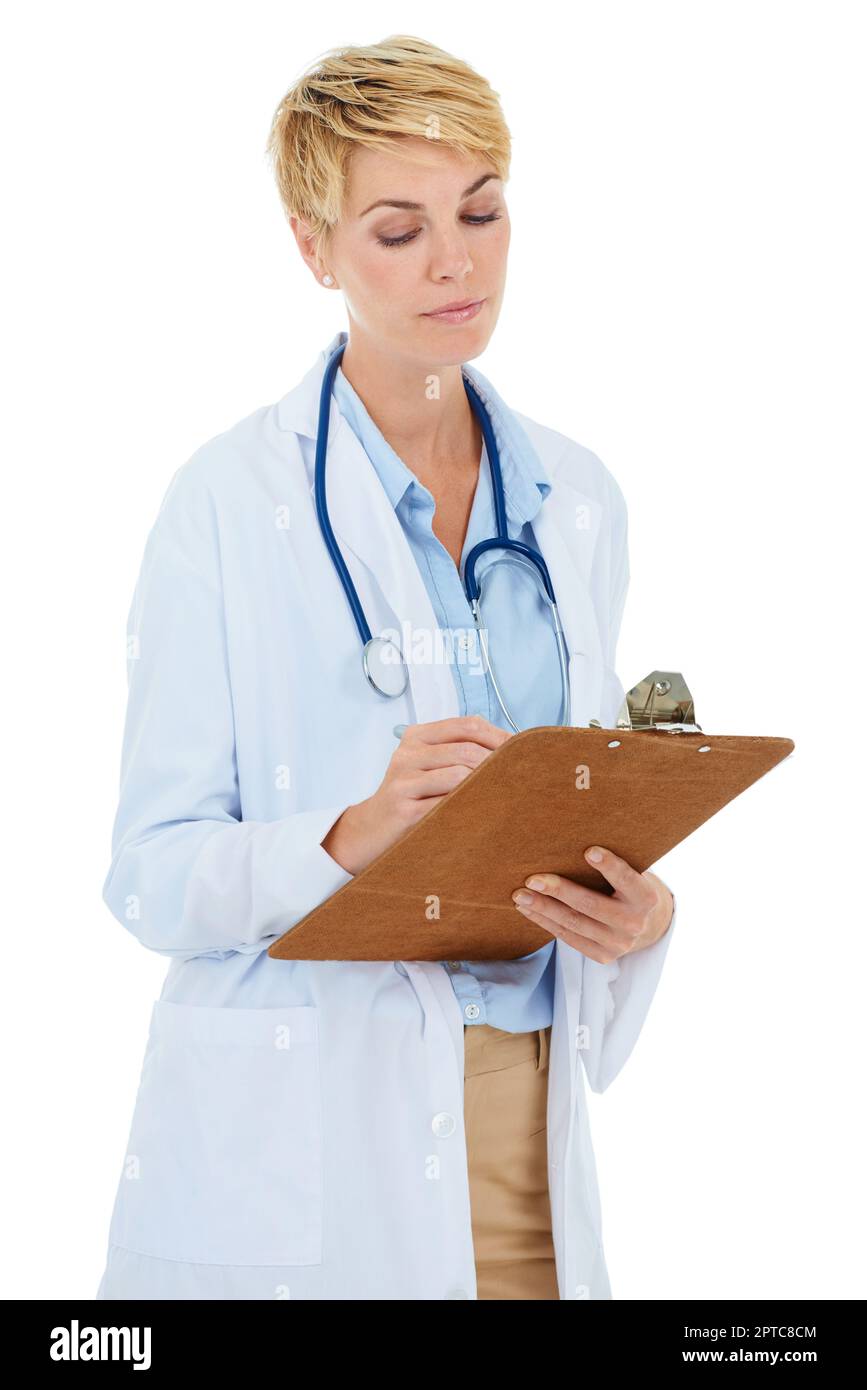 Making notes about the patients recovery. A young female doctor writing ...