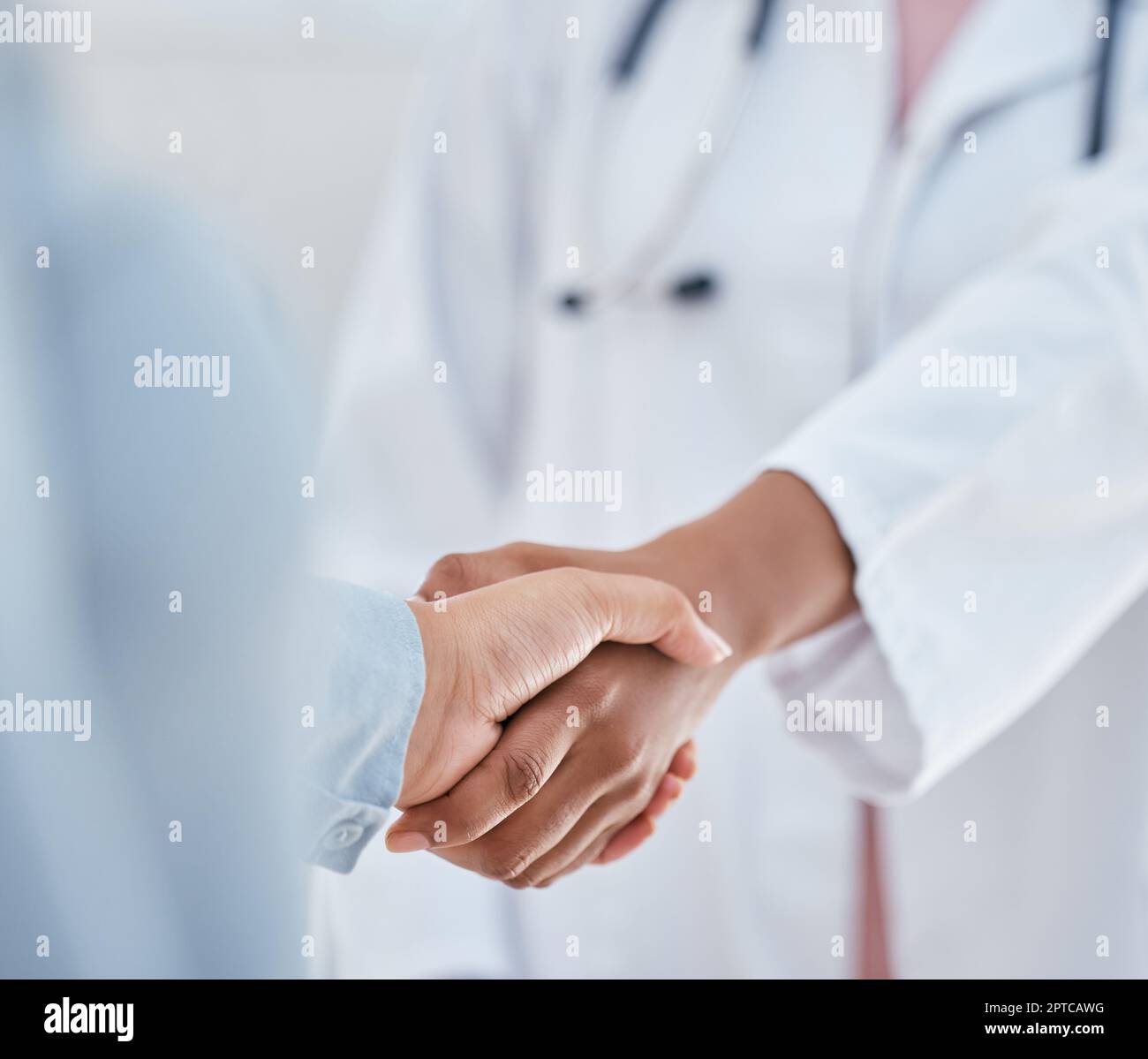 Handshake, trust and thank you with patient and doctor or medical worker shaking hands, greeting
