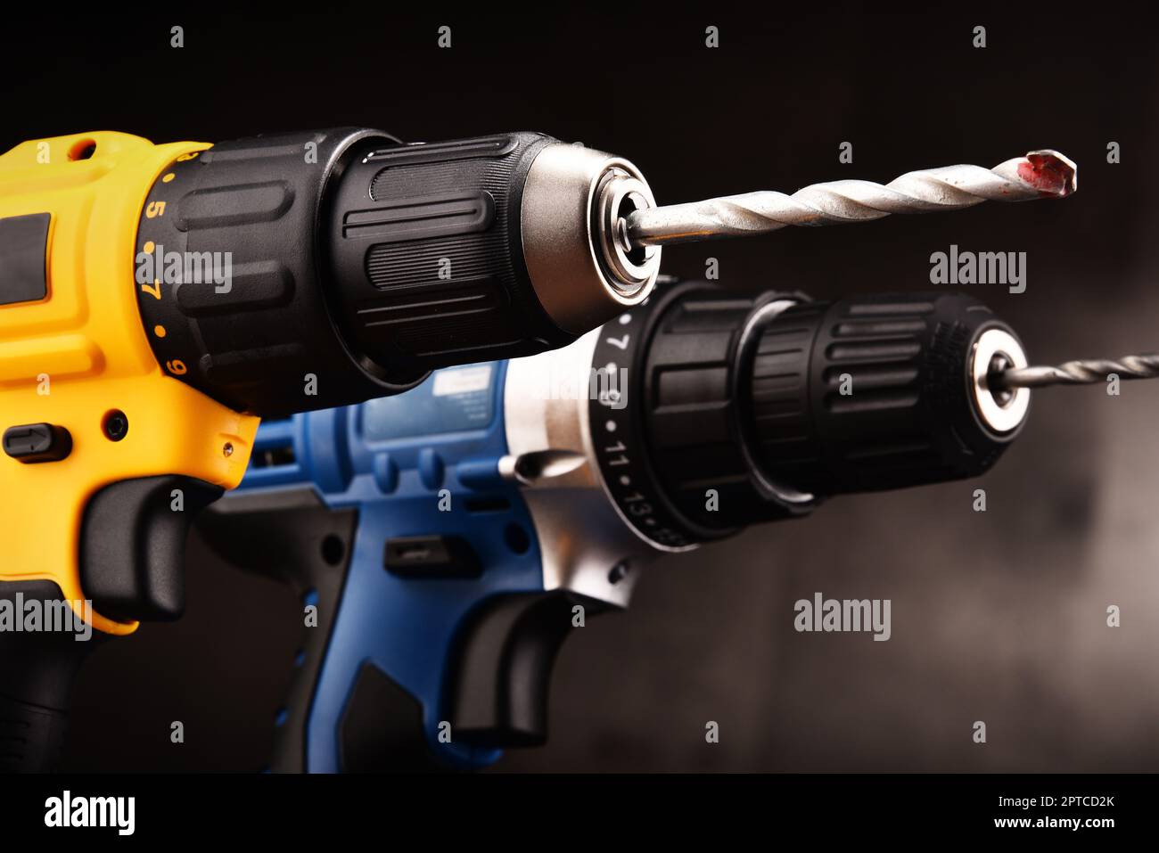 Two cordless drills with drill bits working also as screw guns. Stock Photo
