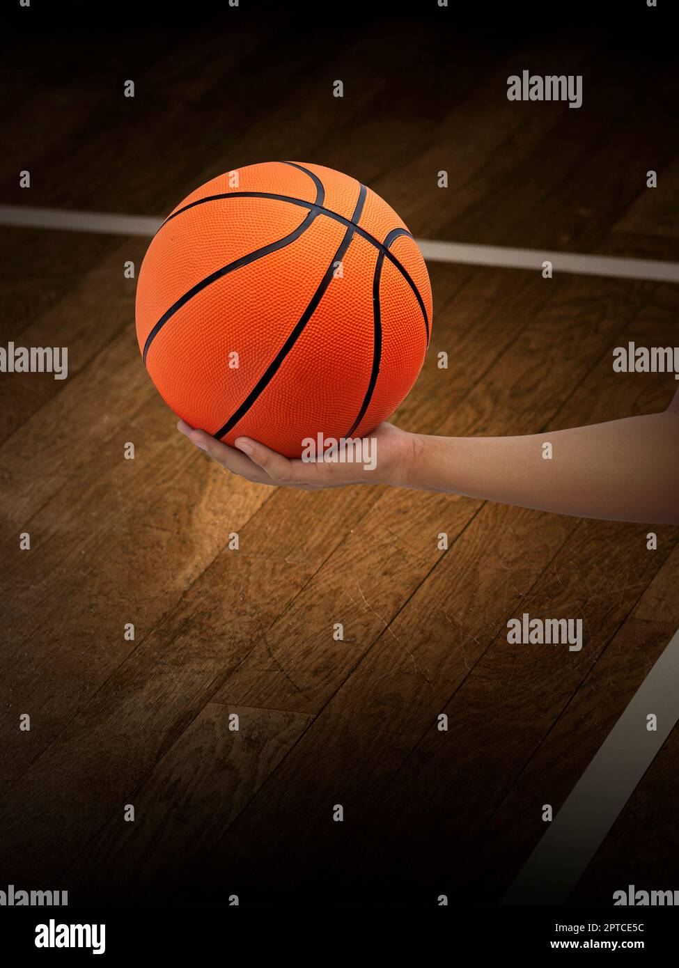 basketball ball in man's hand Stock Photo - Alamy