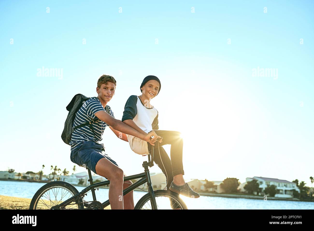 Im always happy to give my brother a ride. Cropped portrait of a young