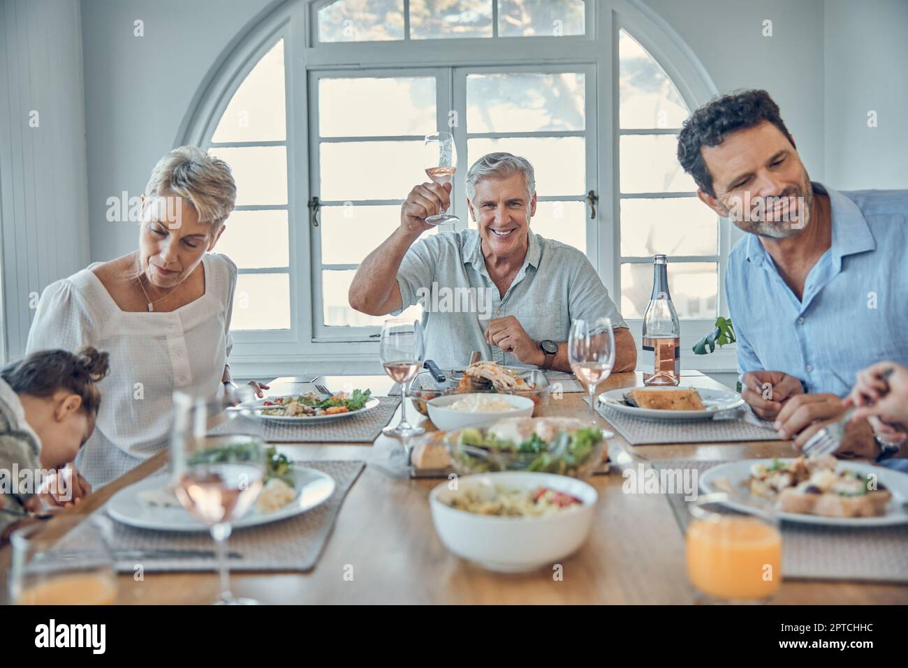 Big family, lunch and happy celebration toast with grandparents