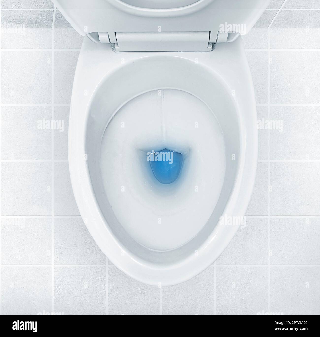 Top view of toilet bowl, blue detergent flushing in it Stock Photo Alamy