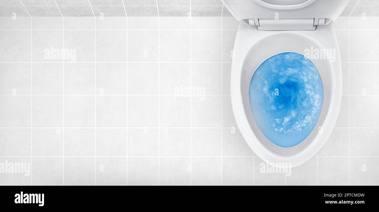 Top view of toilet bowl, blue detergent flushing in it Stock Photo Alamy