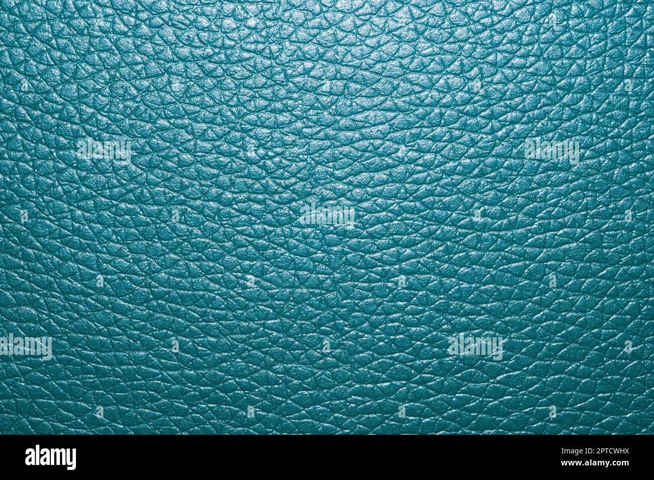 Blue colored leather surface background close up Stock Photo