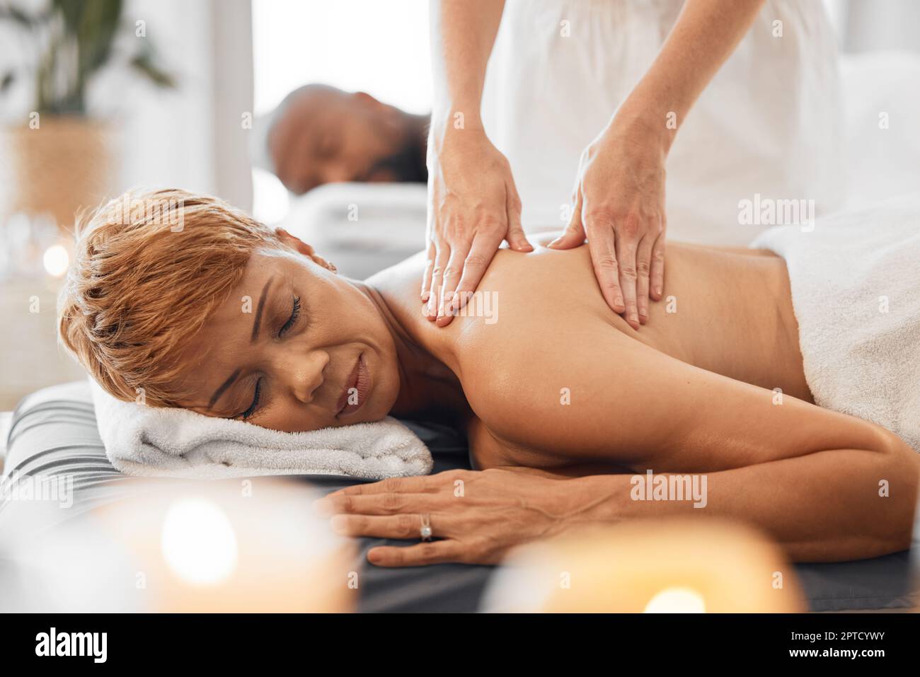 Shoulder and neck massage for woman in spa salon. Stock Photo by