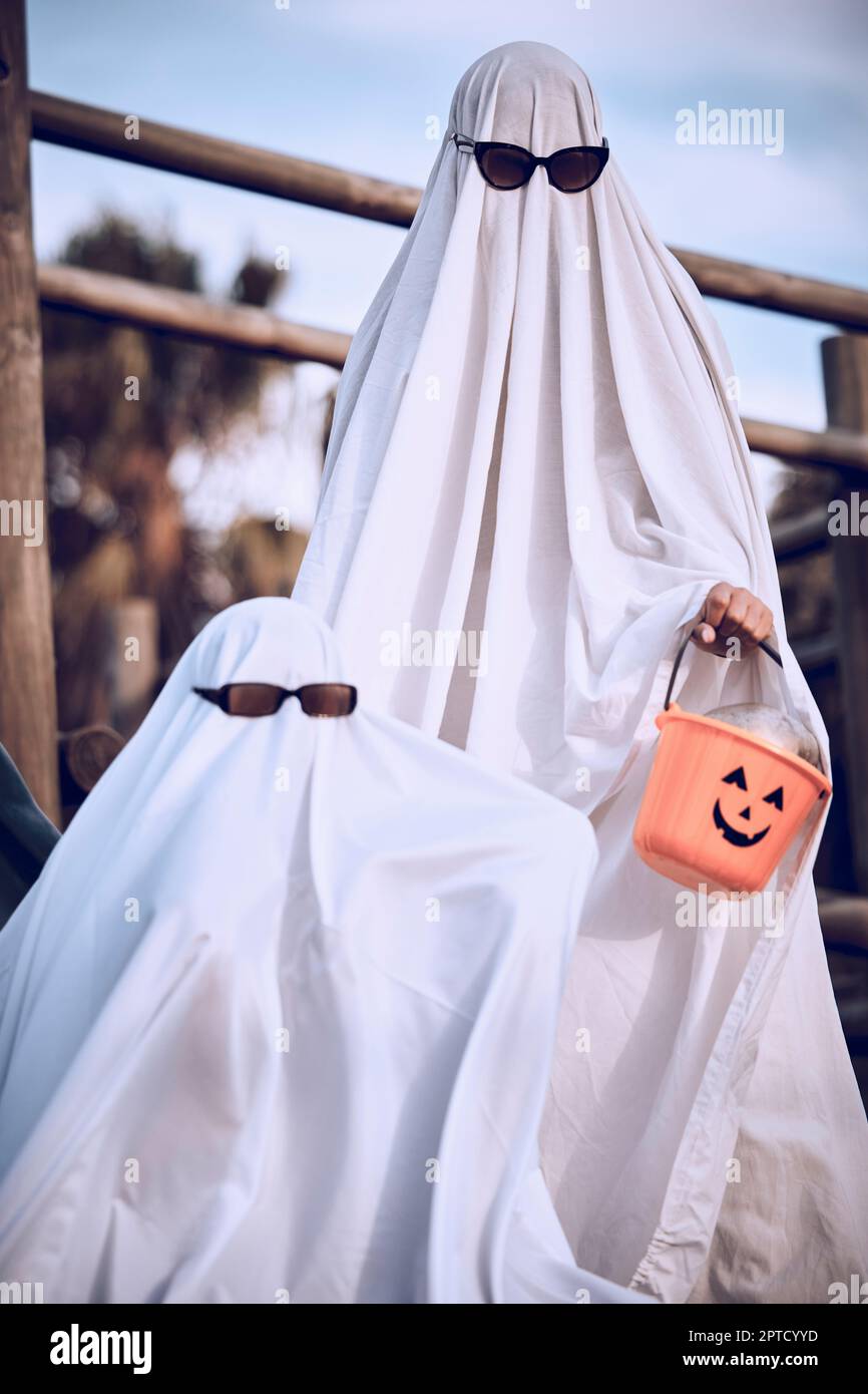 Halloween, friends and ghost costume for fun, festival and celebration  while bonding at park, happy and cool. Spooky, dress up and event with  people i Stock Photo - Alamy