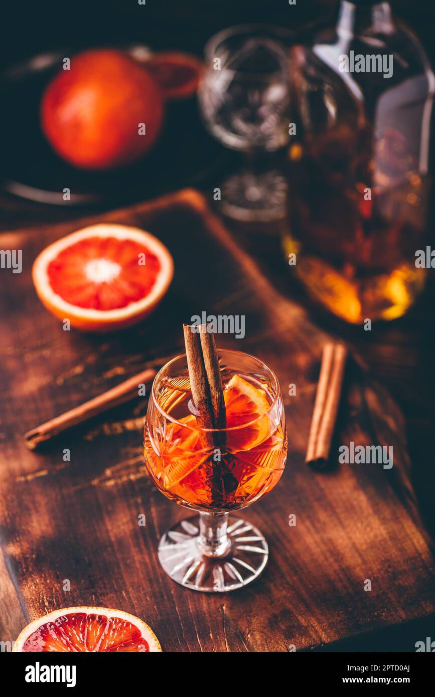 Orange whiskey sour cocktail with bourbon, blood orange juice and